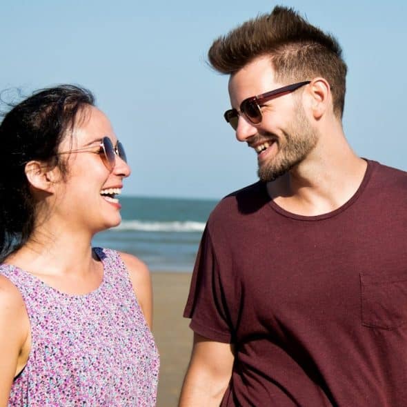 A couple enjoying each other's company at a beach.