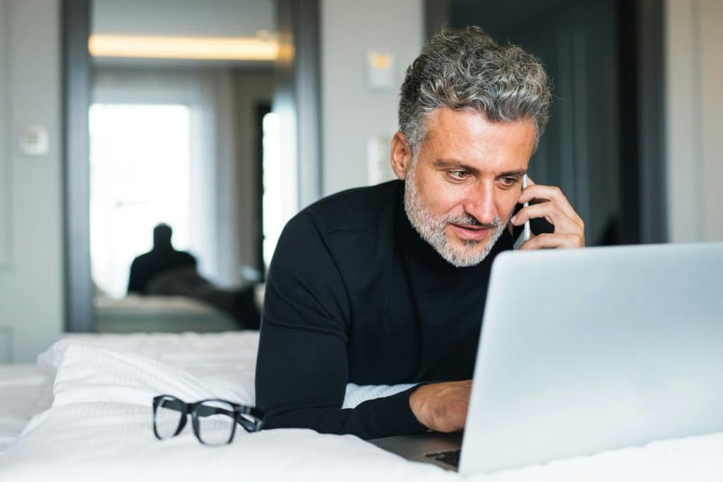 A man using a laptop.