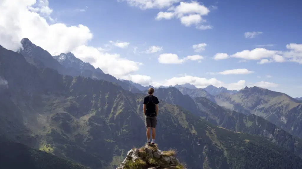 A man on top of a mountain