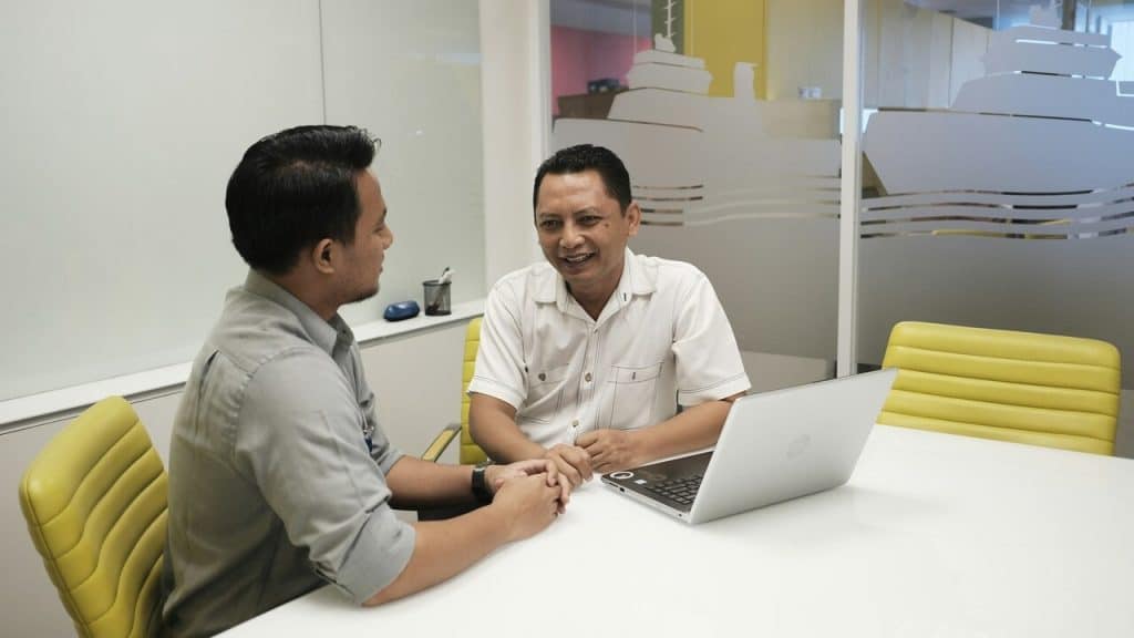 Colleagues talking at work
