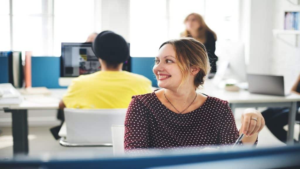 A woman smiling in the office 