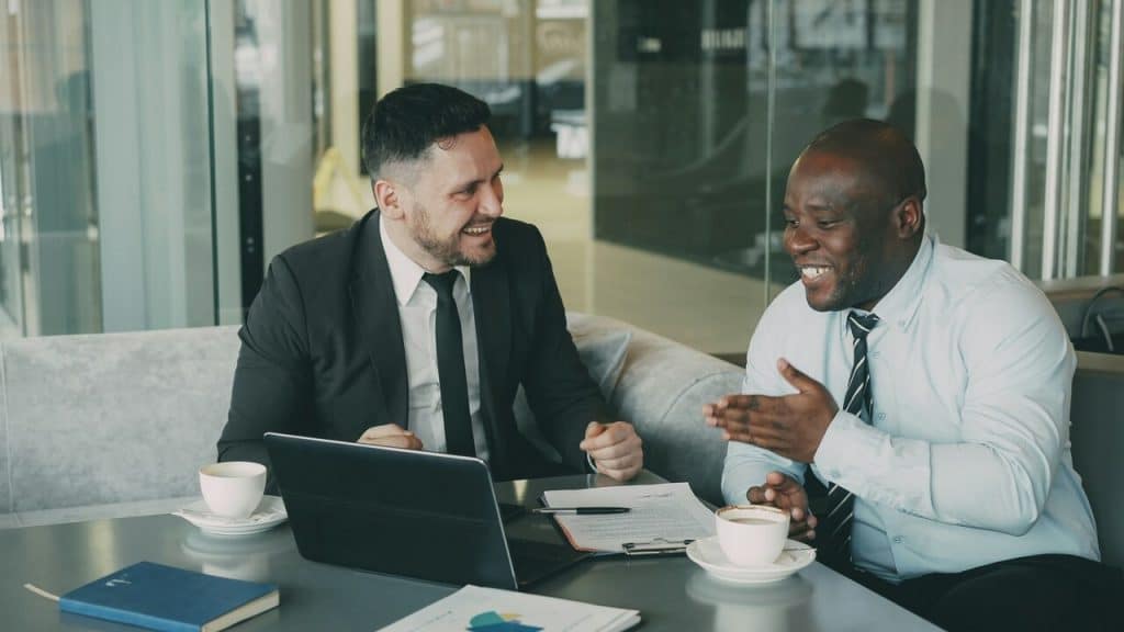 Colleagues laughing together in the office