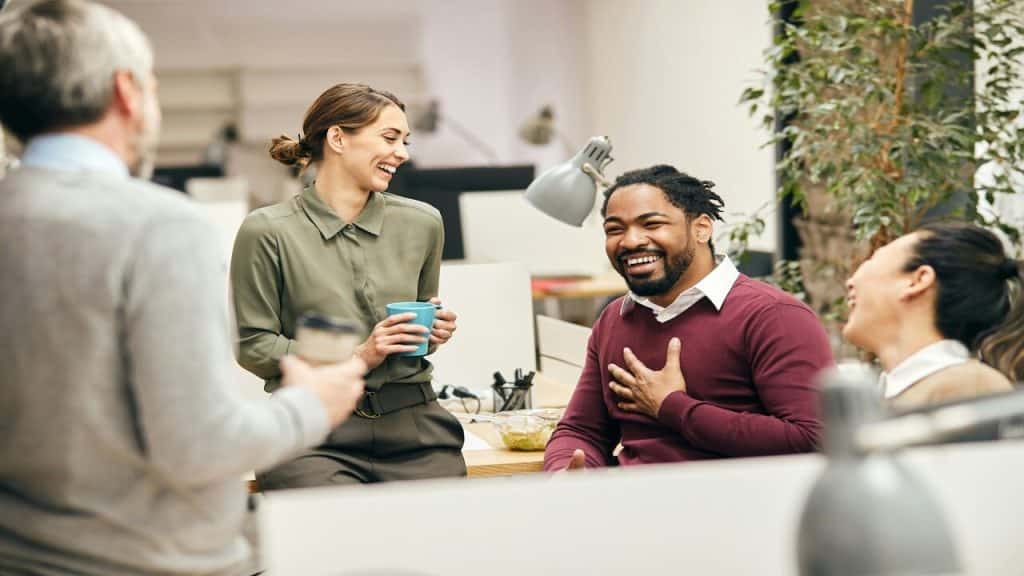 Colleagues laughing together