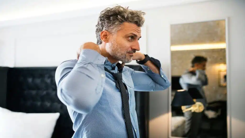A mature man in a luxurious room