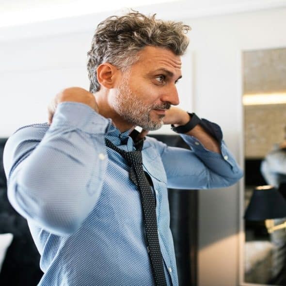 A mature man in a luxurious room