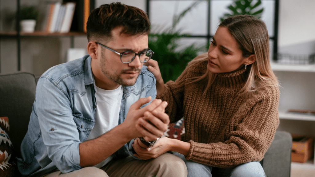 A woman comforting her sad date 