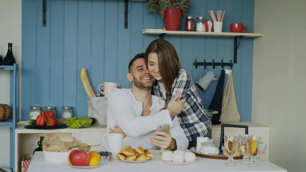 A man and woman hugging each other
