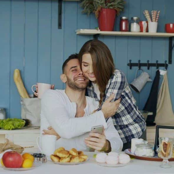 A man and woman hugging each other