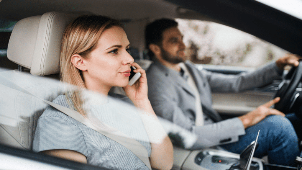 A couple driving to work together