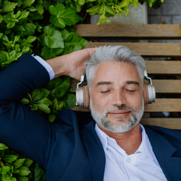 A man relaxing on a bench