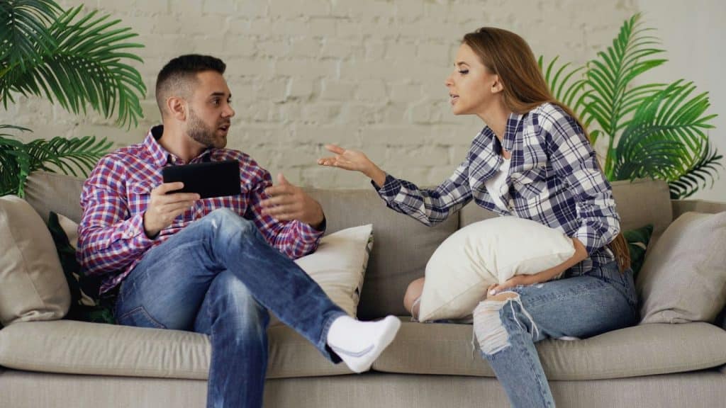A woman complaining to a man