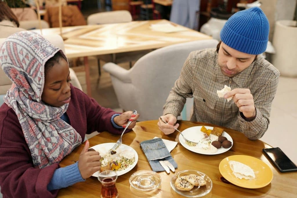 A couple eating at a restaurant.
