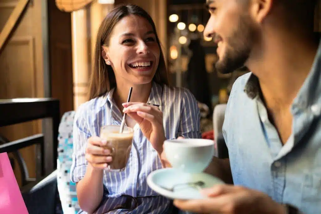 A couple on a date in a coffee shop.