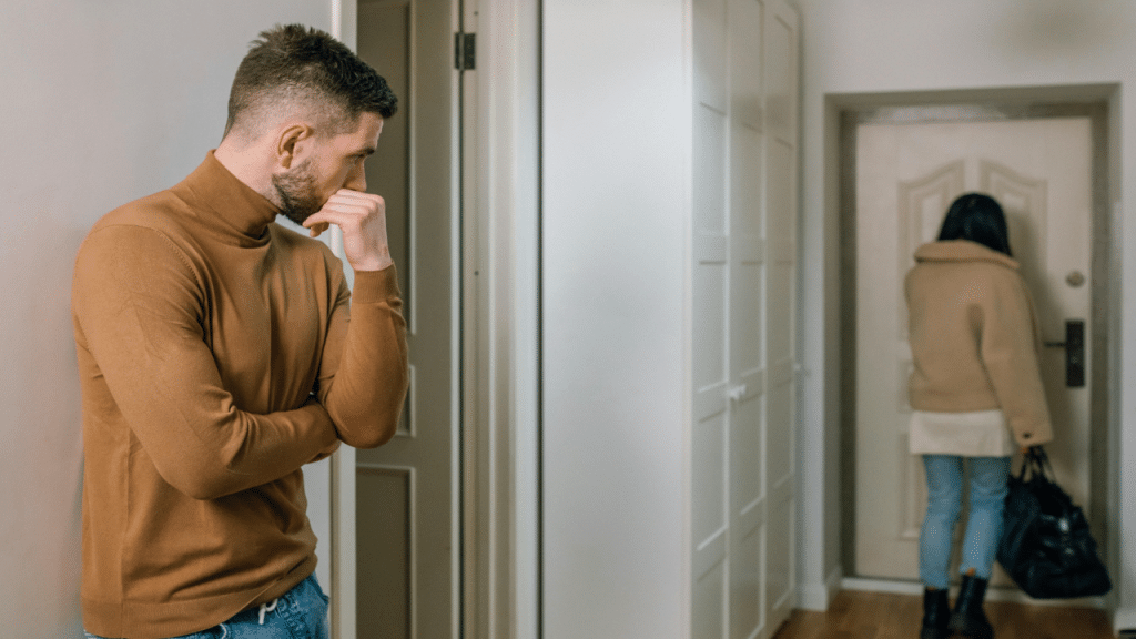 A man watching his wife walk away