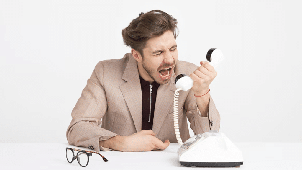 A man yelling at the phone
