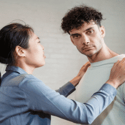 A man refusing to look at his crying girlfriend