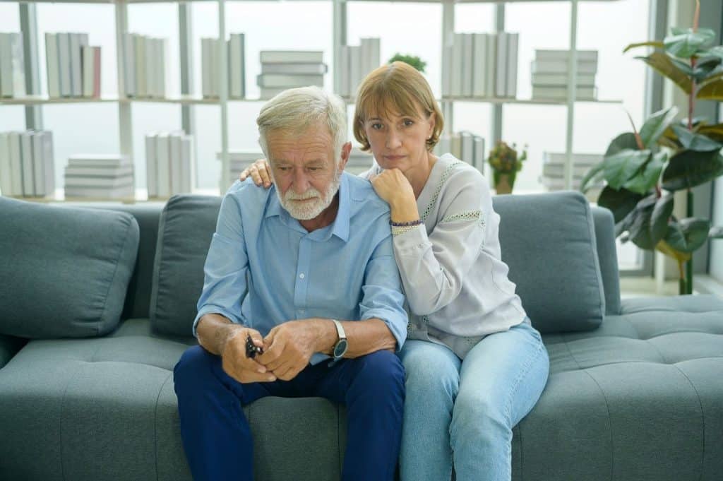 A man and woman at the couch