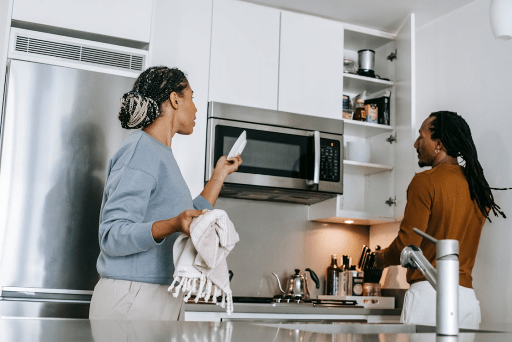 Black couple having conflict in kitchen