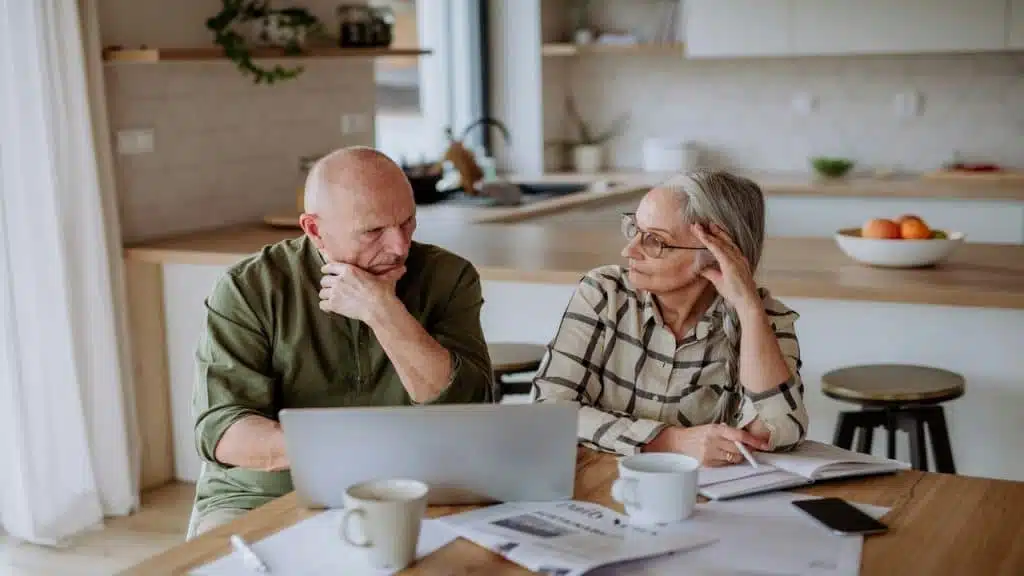 A couple calculating their expenses