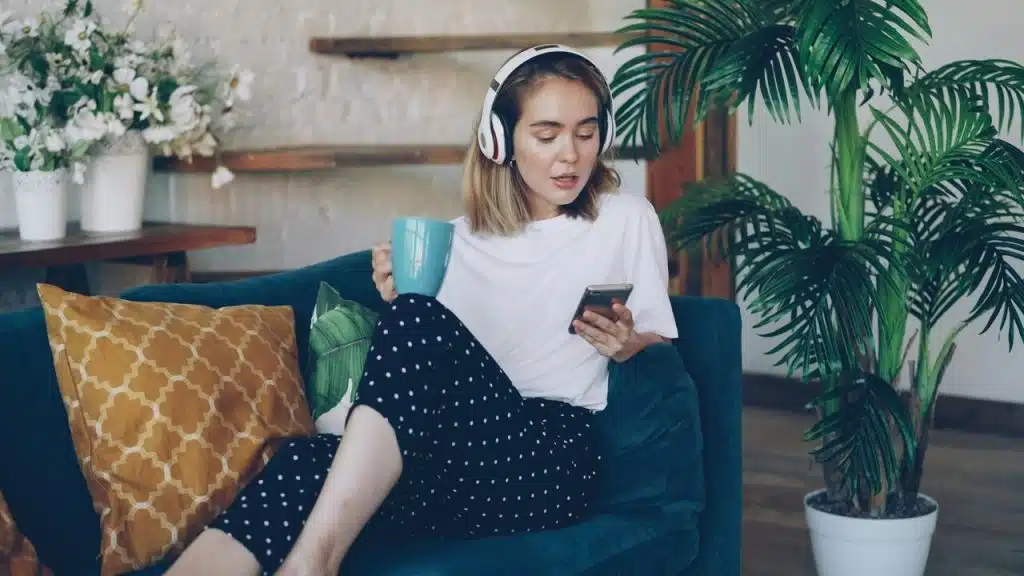 A woman listening to music at home