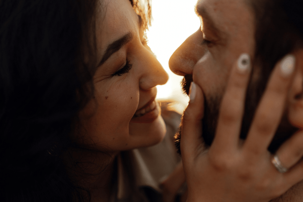 Romantic Close-Up of Smiling Couple at Sunset