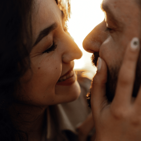 Romantic Close-Up of Smiling Couple at Sunset