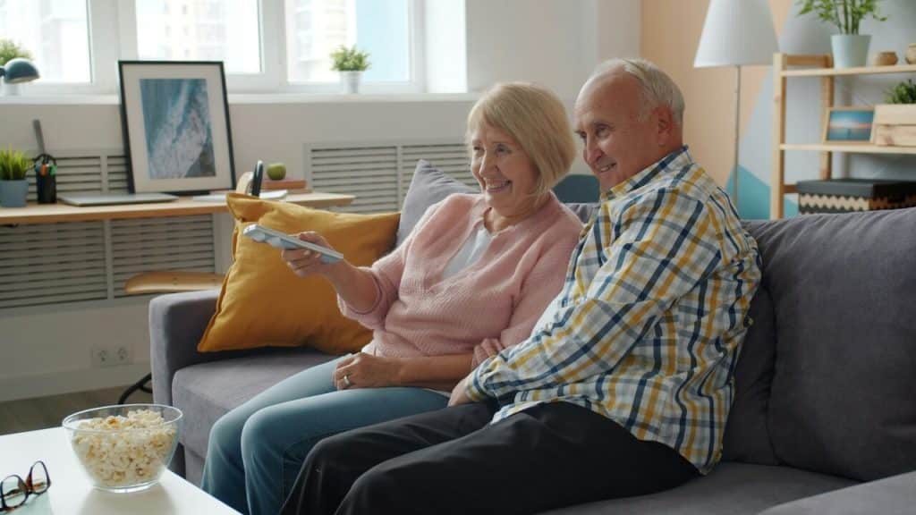 A couple watching a movie at home 