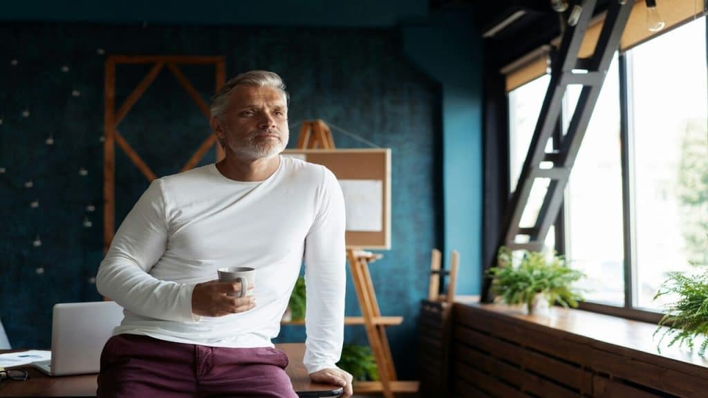 A man looking pensive in his office