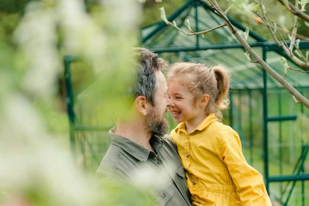 A mature father spending time with his little daughter.