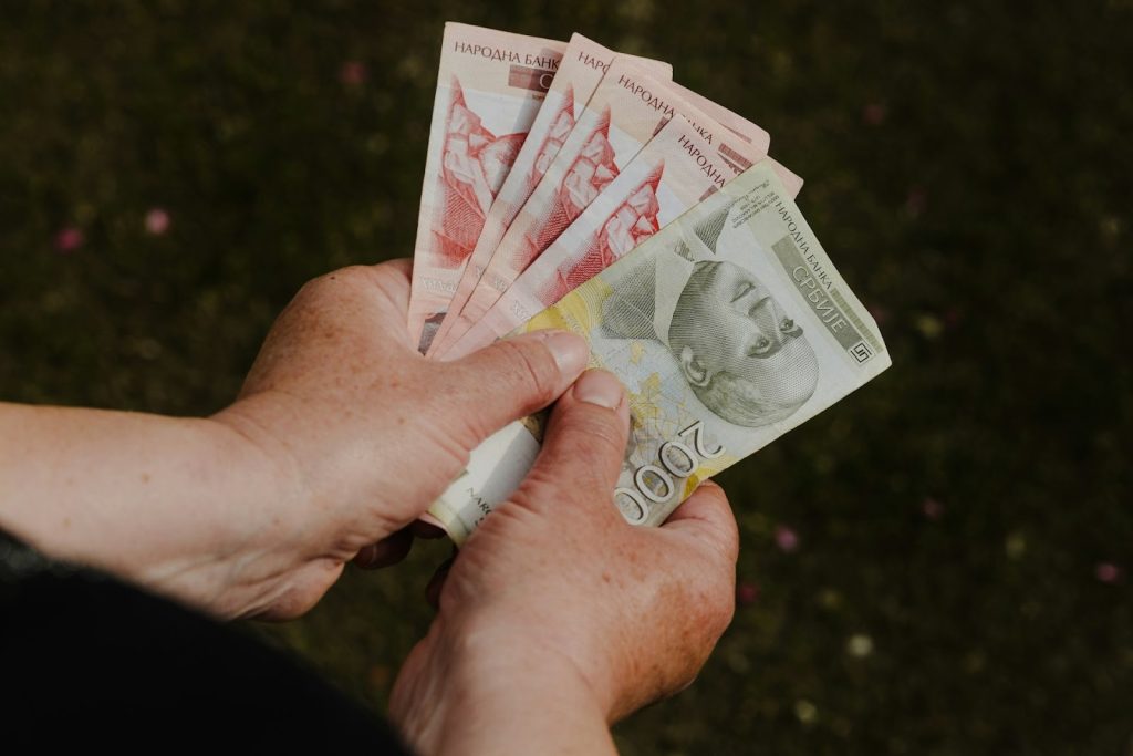 A person holding money.