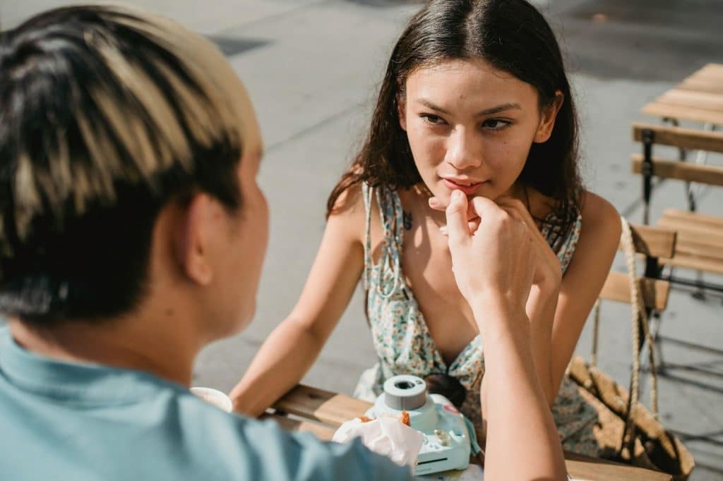 A man wiping woman’s mouth