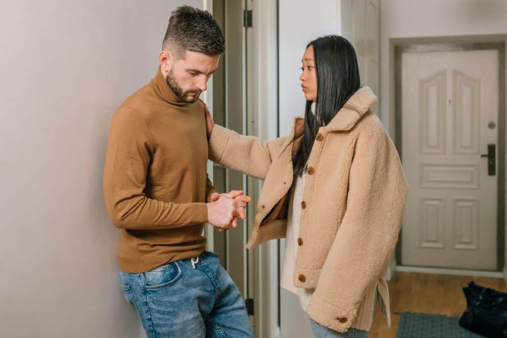 A sad woman and a man listening to her 