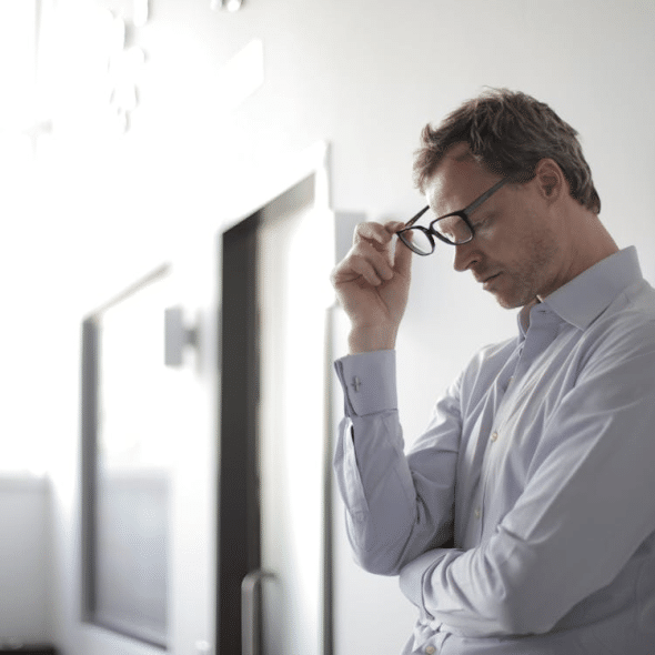 Photo Of Man Holding Black Eyeglasses