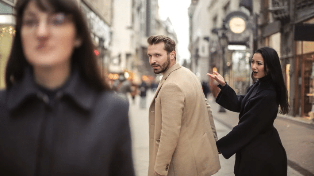 A man looking at another woman