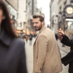 A man looking at another woman