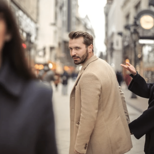 A man looking at another woman