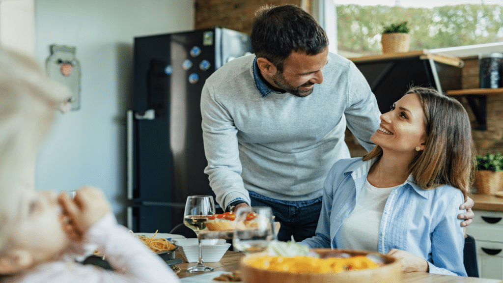 A couple talking to his wife during a family lunch