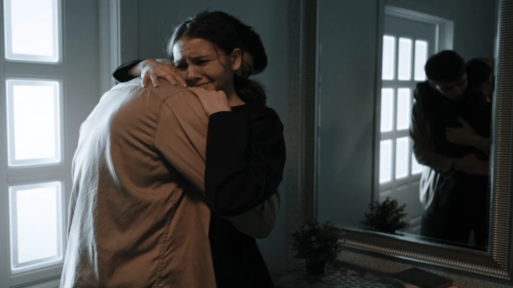 A man hugging his crying wife