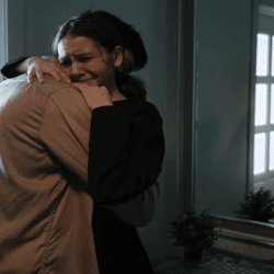 A man hugging his crying wife