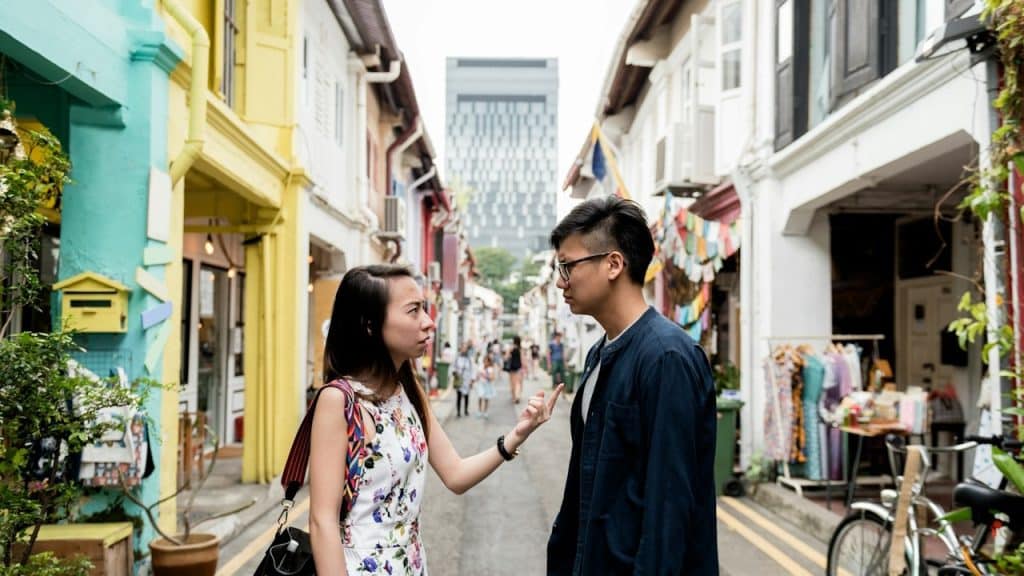 An angry woman arguing with her silent boyfriend.