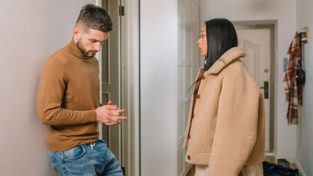 A couple arguing by the entryway