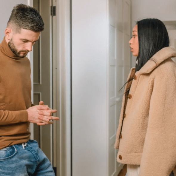 A couple arguing by the entryway