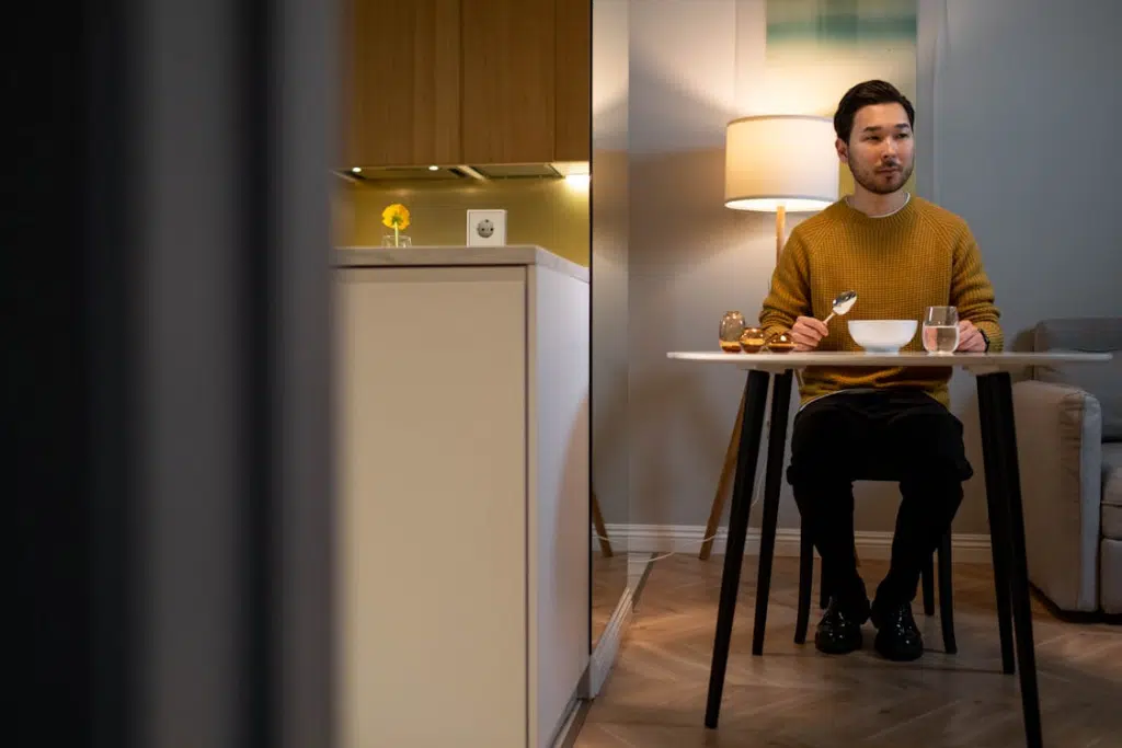 A man eating at the table alone