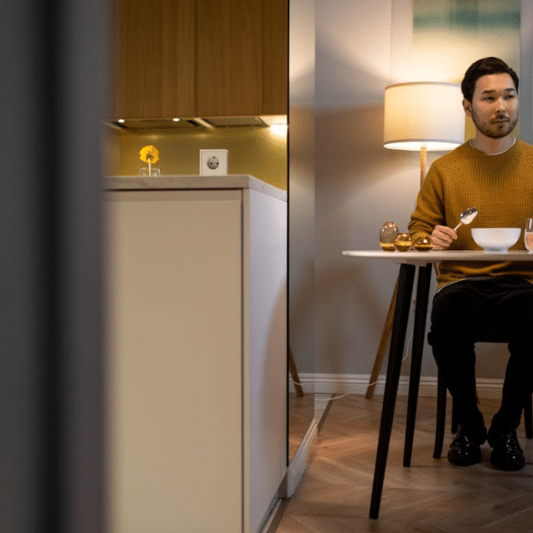 A man eating at the table alone