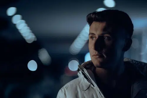 A man looking at the side