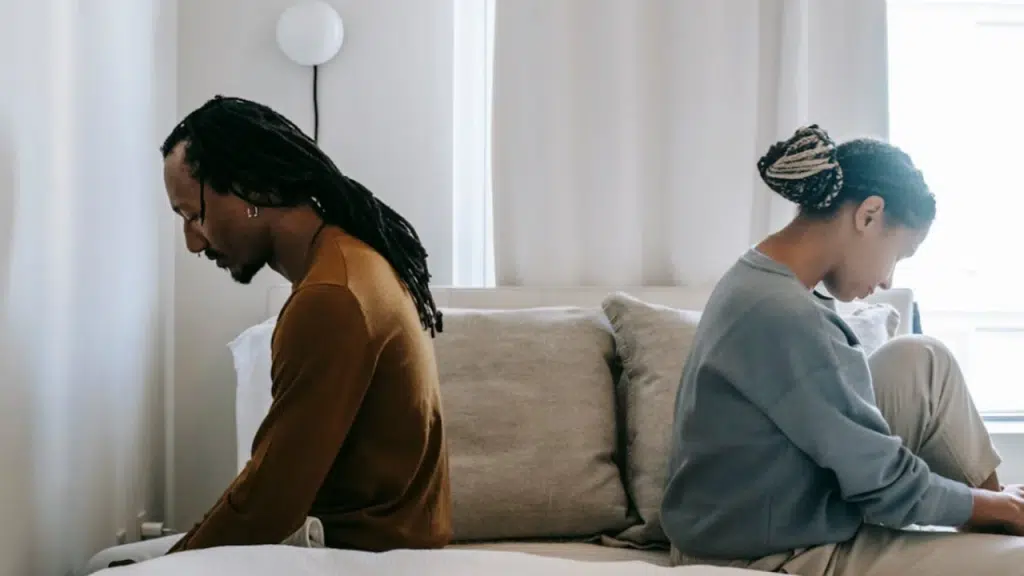 A couple looking upset at home 