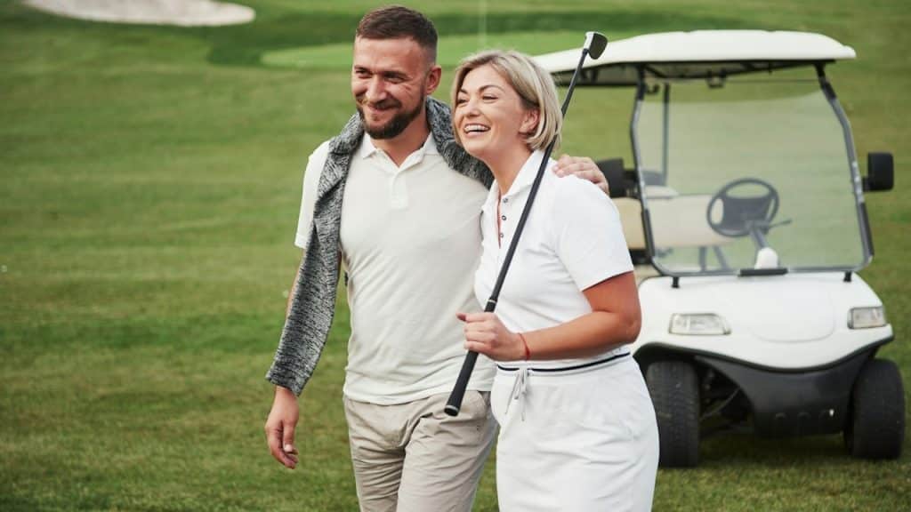 Two golfers go together to the next hole.