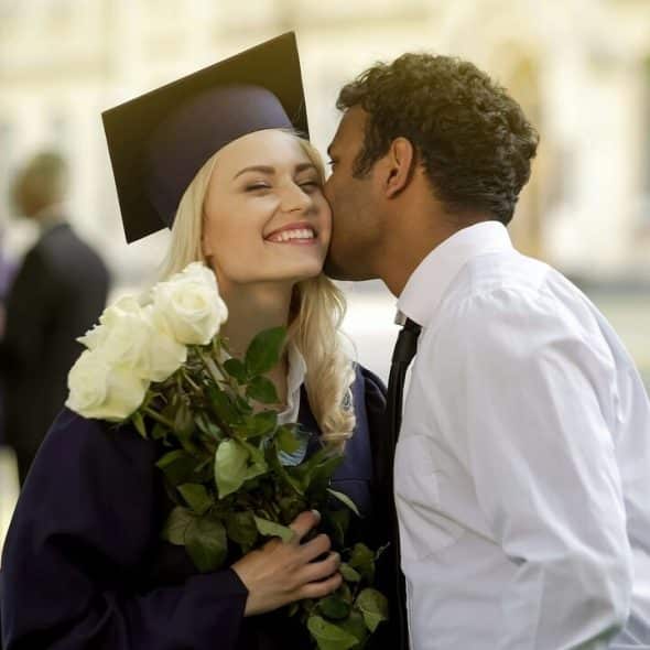 A man congratulating his wife on graduating