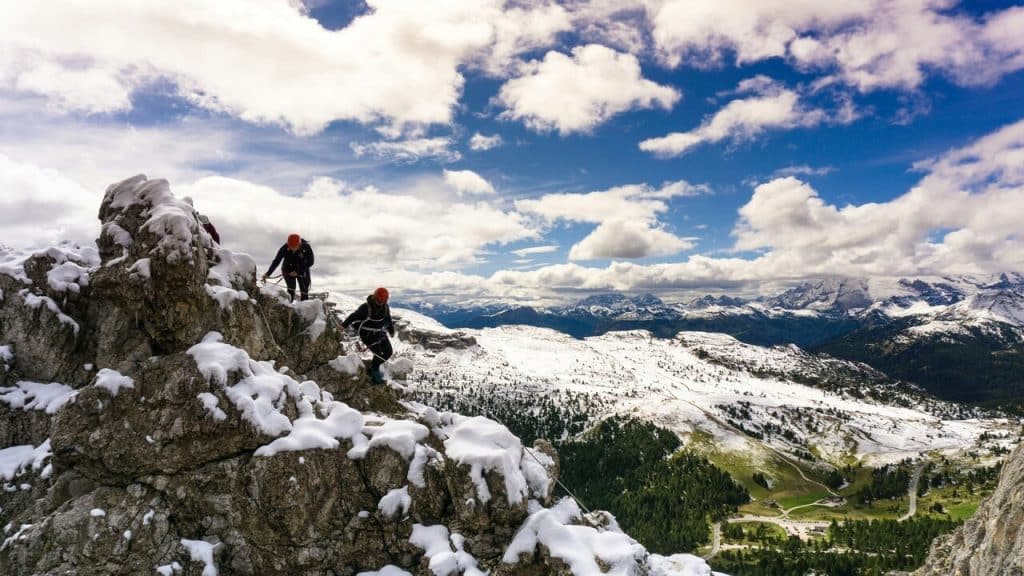 A couple hiking on a snowy mountain