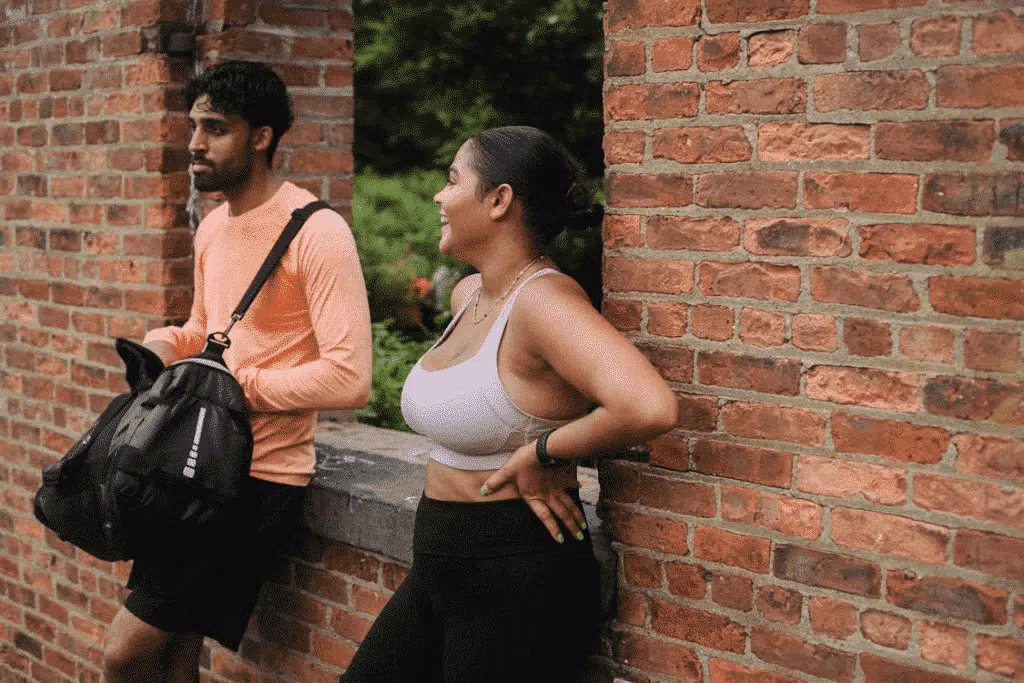 A man and a woman standing outside